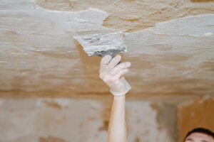 Fix Ceiling Water Damage and Stop Leaks Before They Start - Corner Flaking off - Cover in layer
